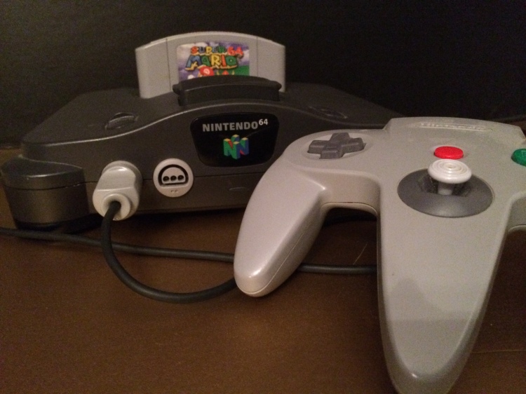 Seen above are my Nintendo 64 game console, controller and copy of “Super Mario 64.”